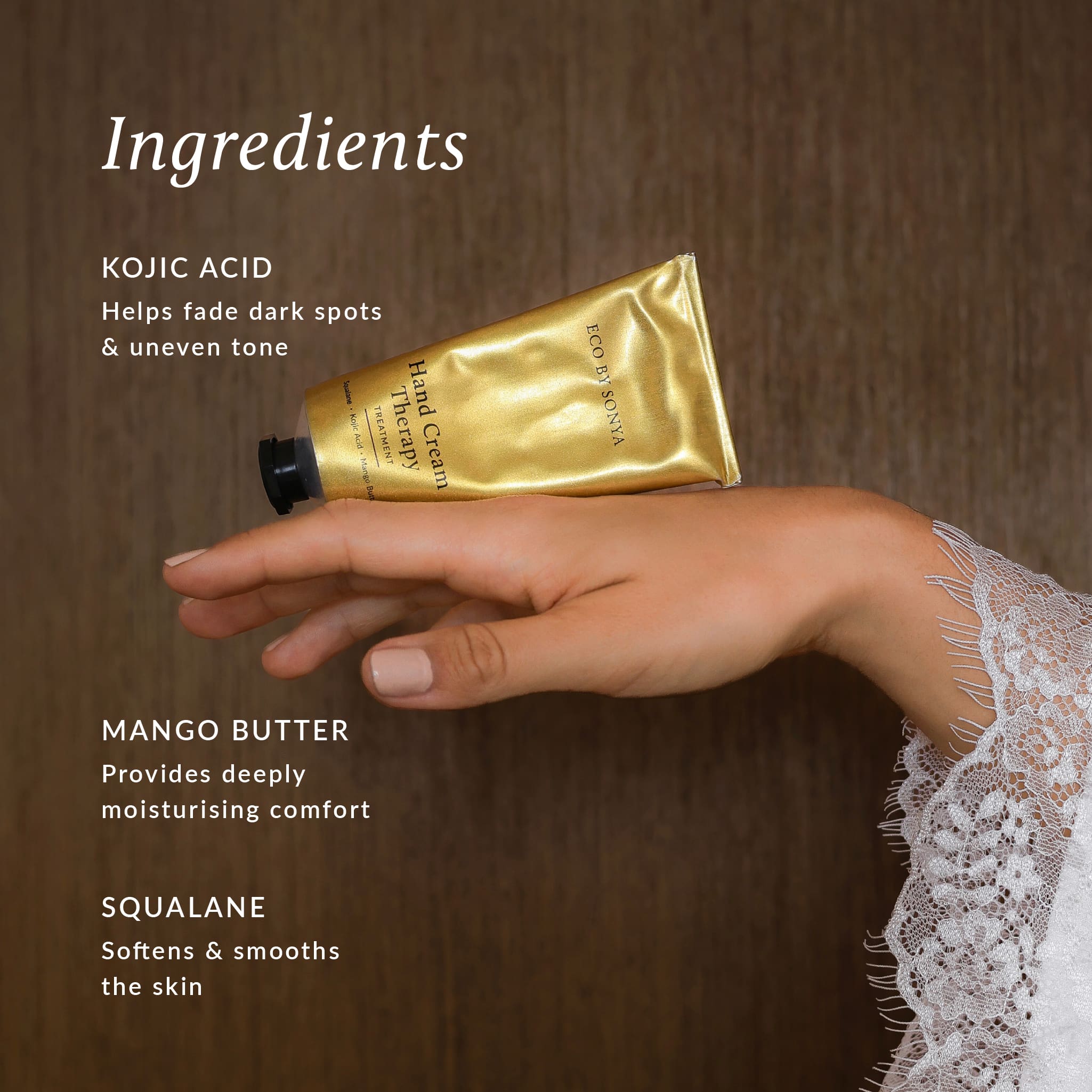 Hand balancing Eco By Sonya Hand Cream Therapy Treatment, with text highlighting kojic acid, mango butter and squalane.
