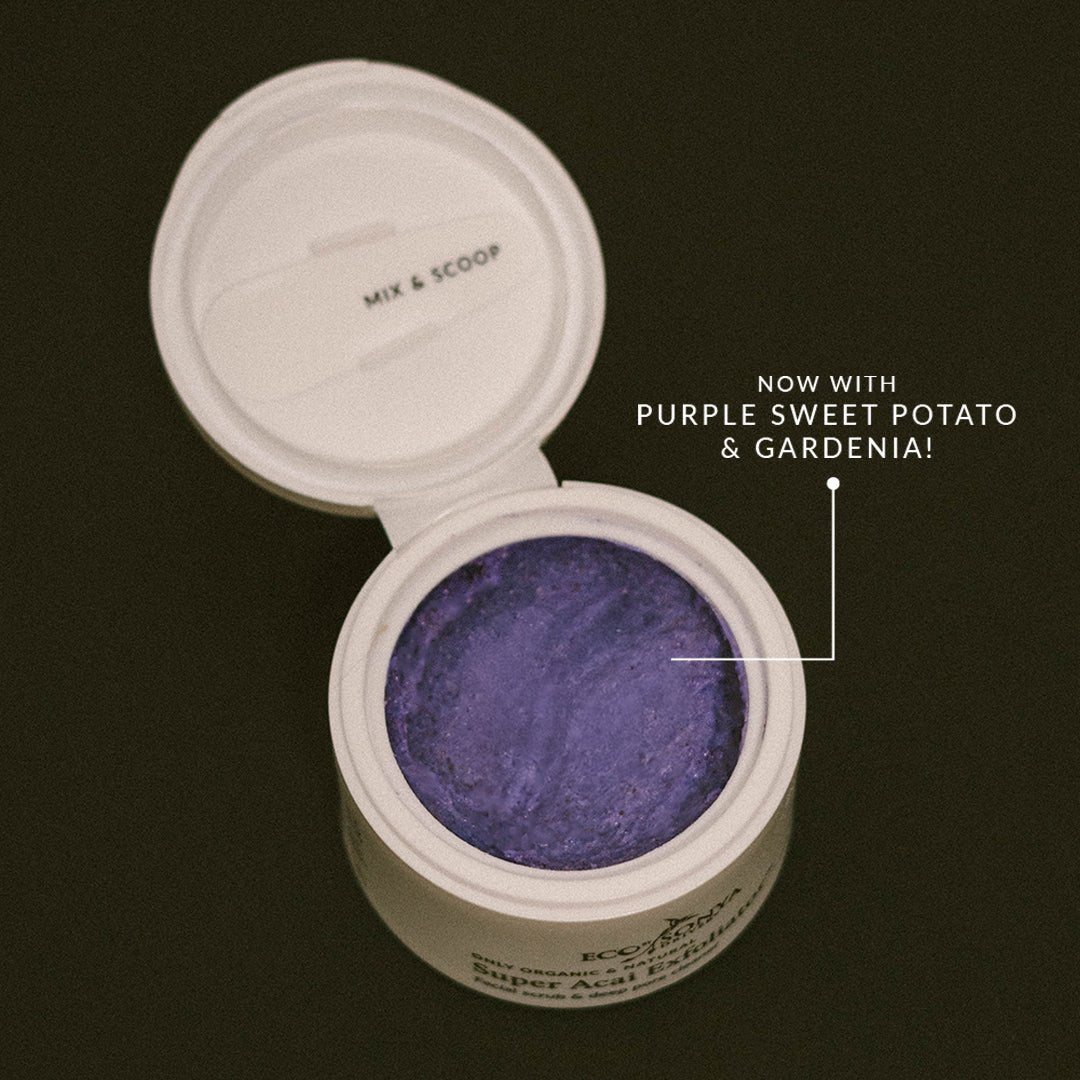 Eco By Sonya Super Acai Exfoliator jar open showing creamy purple texture and label reading ‘now with purple sweet potato & gardenia’ on dark background.